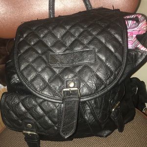 Selling a nice black “purse” backpack!